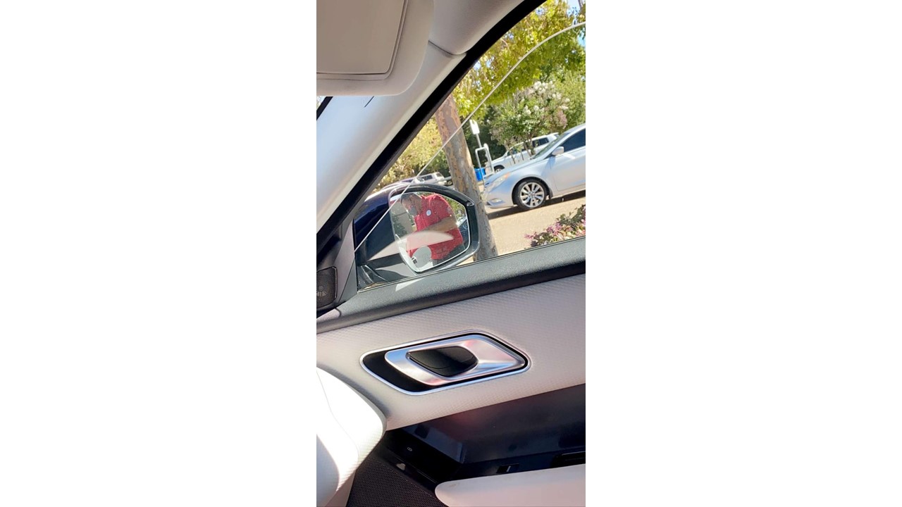 Team Member in the side mirror
