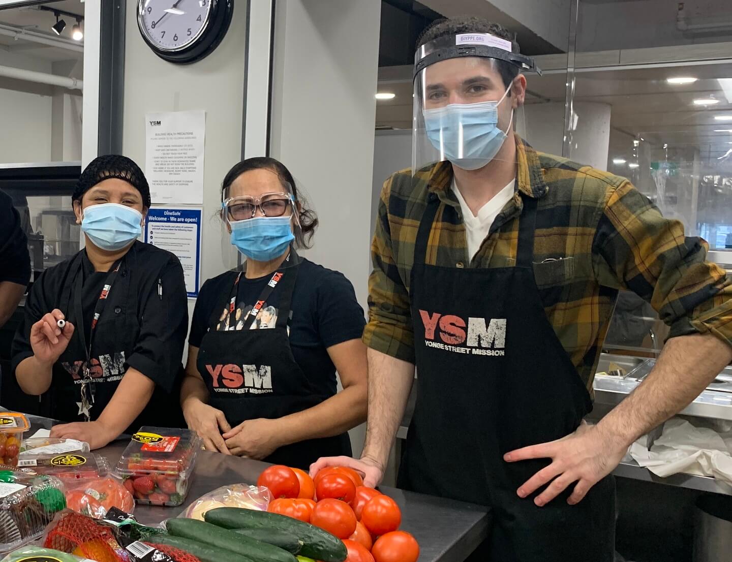 three people in a food kitchen