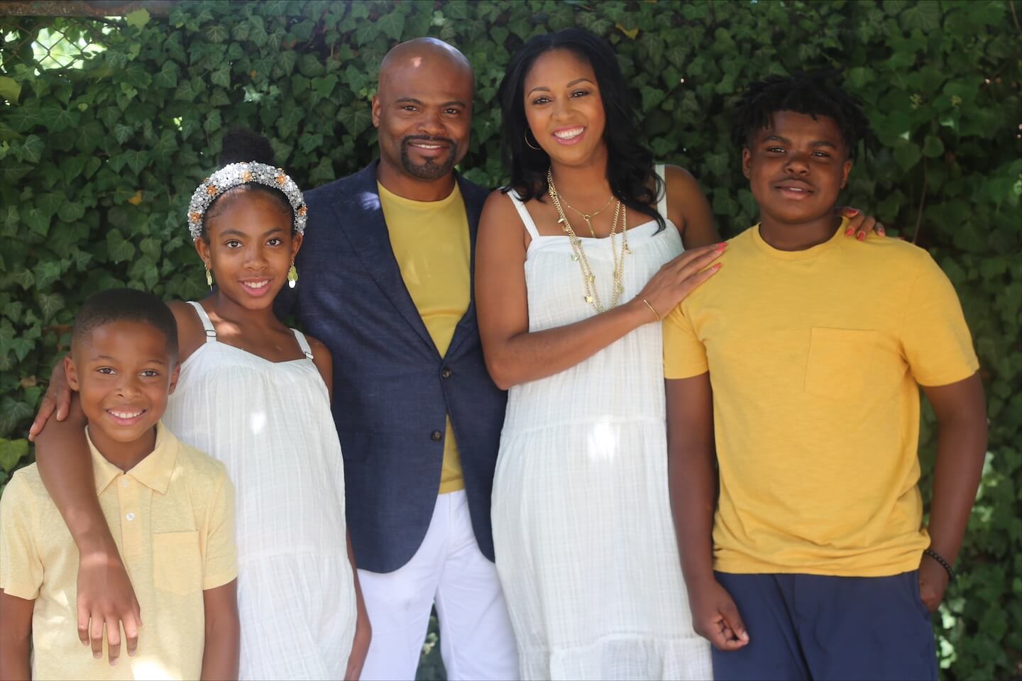 Sereena Quick stands with her husband, two sons and daughter outside