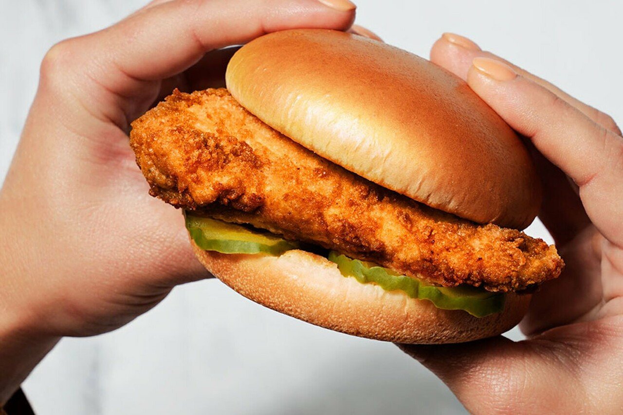 Two hands holding an original Chick-fil-A Chicken Sandwich 