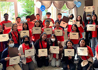 Chick-fil-A Leader Academy participants holding a certificate 