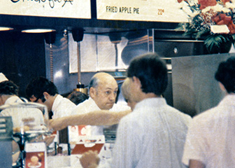 Chick-fil-A founder S. Truett Cathy working in the kitchen of the original Dwarf Grill in Hapeville, Georgia.