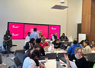 The first cohort of the Beyond School Walls program doing a resume writing activity in a conference room at the Chick-fil-A Support Center.