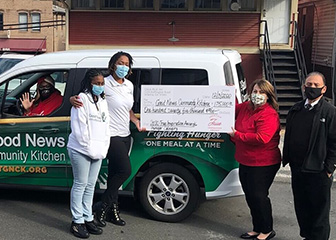 Representatives from the Good News Communiuty Kitchen and Chick-fil-A pose with a $175,000 check as part of the 2020 True Inspiration Awards.
