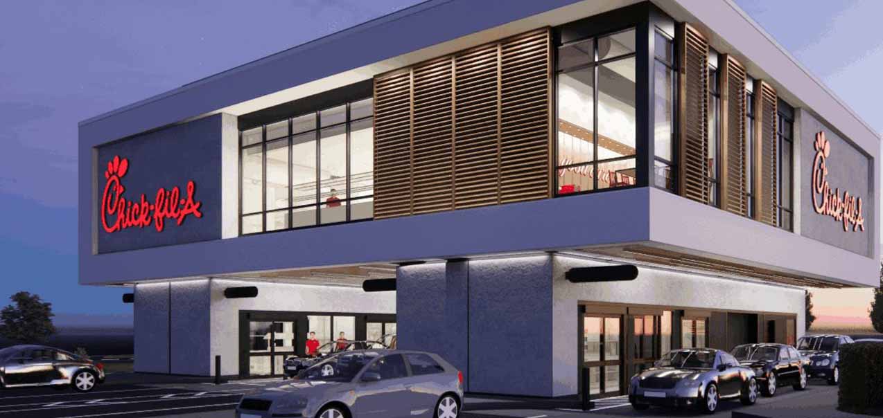 A concept image of the new Chick-fil-A elevated drive-thru restaurant set to open in the Atlanta metro area in 2024, with cars in line in the evening.