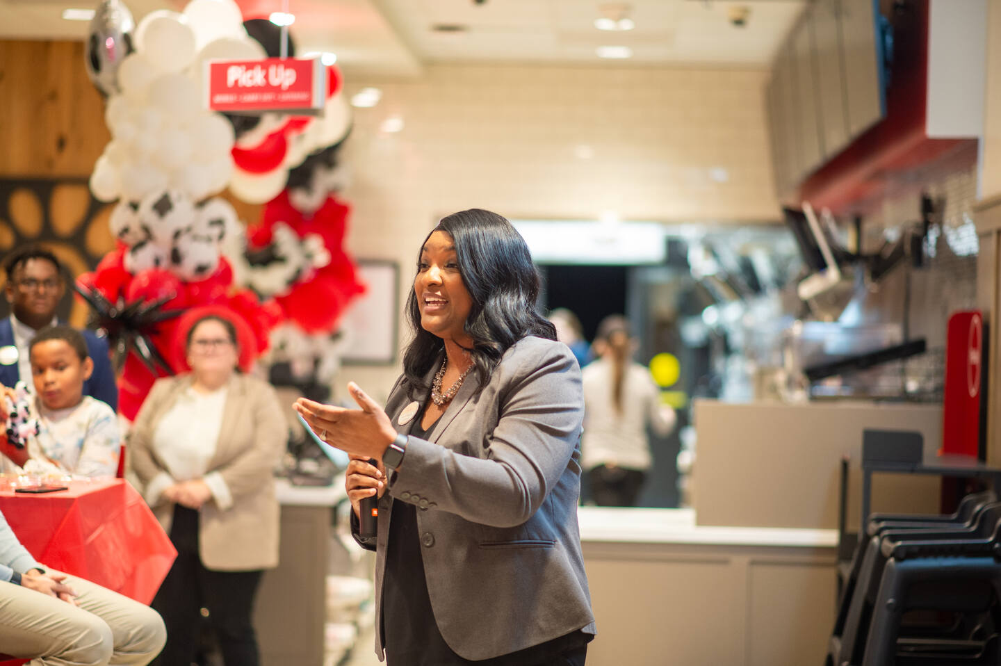 Katie Branch speaking to a crowd at her Chick-fil-A.