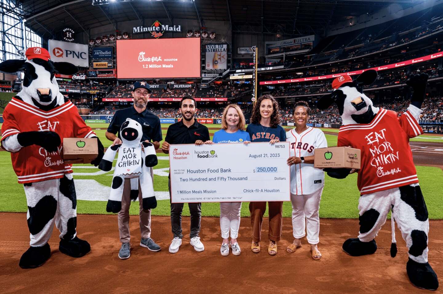 Local Owner Operator David Chaluh donates to Houston Food Bank at Minute Maid Park in Houston, Texas.