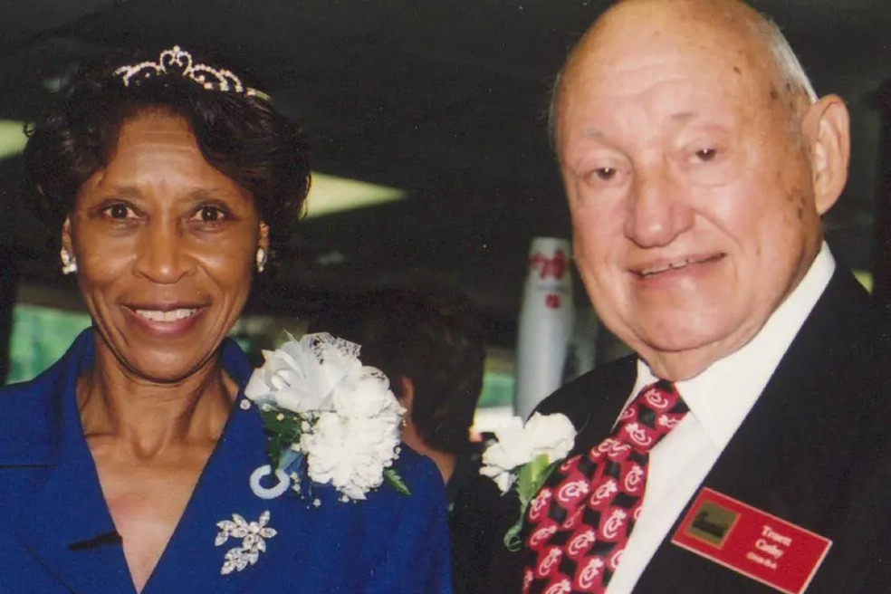 Zelma Calhoun taking a photo with the founder of Chick-fil-A, S. Truett Cathy.