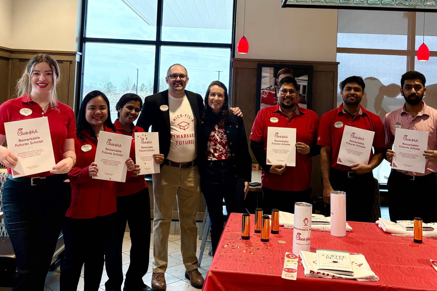Chick-fil-A Remarkable Futures Scholarship recipients standing in a restaurant.