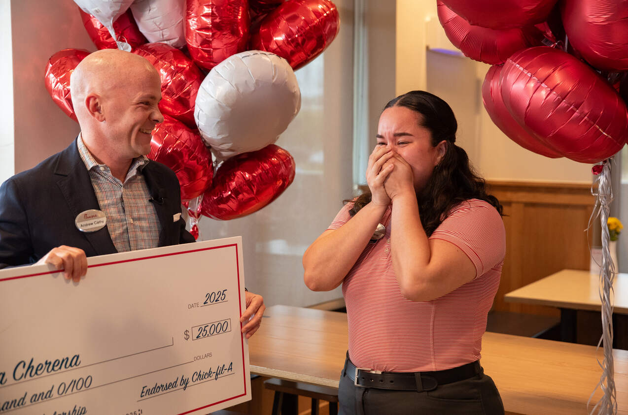 Chick-fil-A CEO Andrew Cathy surprises Nileika Cherna with at $25K scholarship.