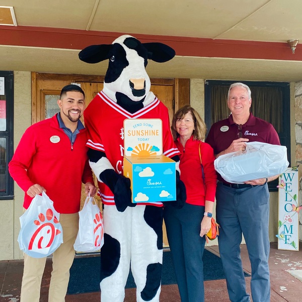 San Antonio Chick-fil-A team and The Cow delivering food to a senior center.