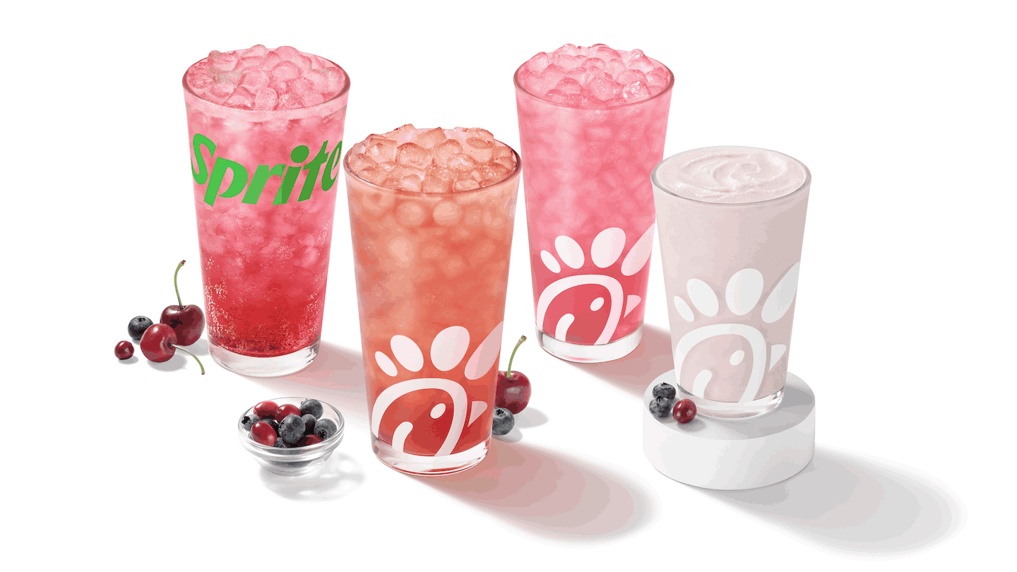 Four glasses of Chick-fil-A's Cherry Berry beverages sitting on a white table.