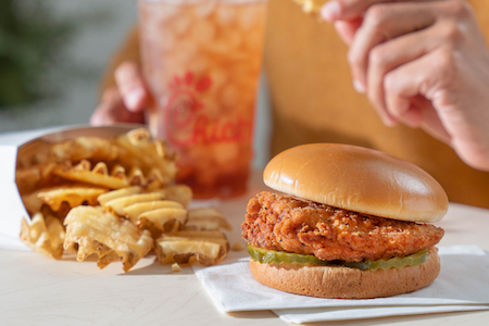 Closeup of Chick-fil-A® Spicy Chicken Sandwich Meal with Waffle Potato Fries™ and an Iced Tea
