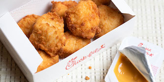 8-count Chick-fil-A® Nuggets in a package with Chick-fil-A® Sauce