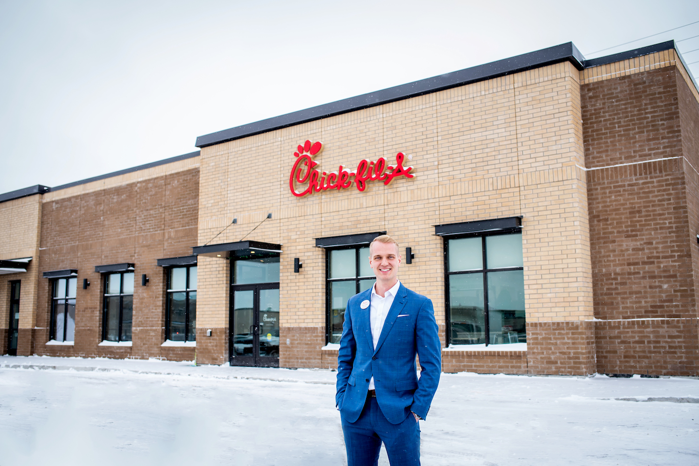New Owner/Operator of Chick-fil-A North Barrie, Lincoln Nikkel, stands outside the restaurant smiling