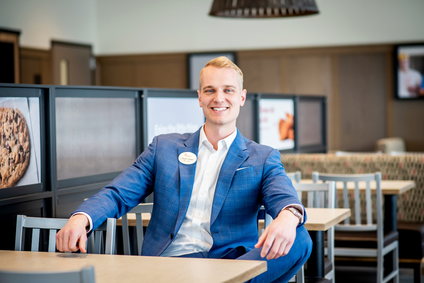 Owner/Operator of Chick-fil-A North Barrie, Lincoln Nikkel, sitting in a Chick-fil-A restaurant