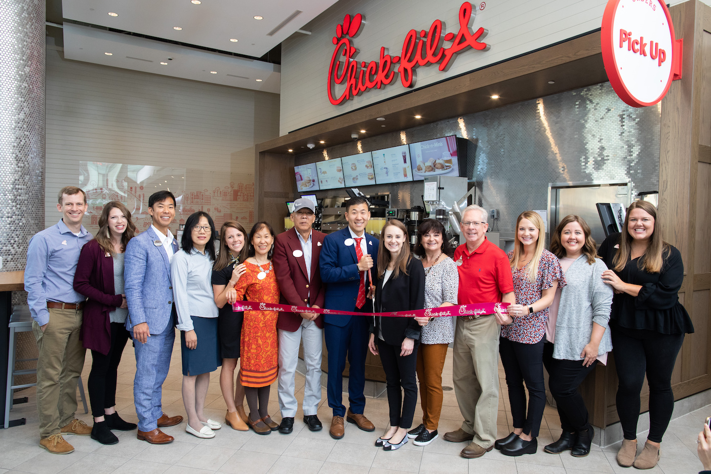 Chick-fil-A Toronto Team standing in front of the restaurant at the Grand Opening last year