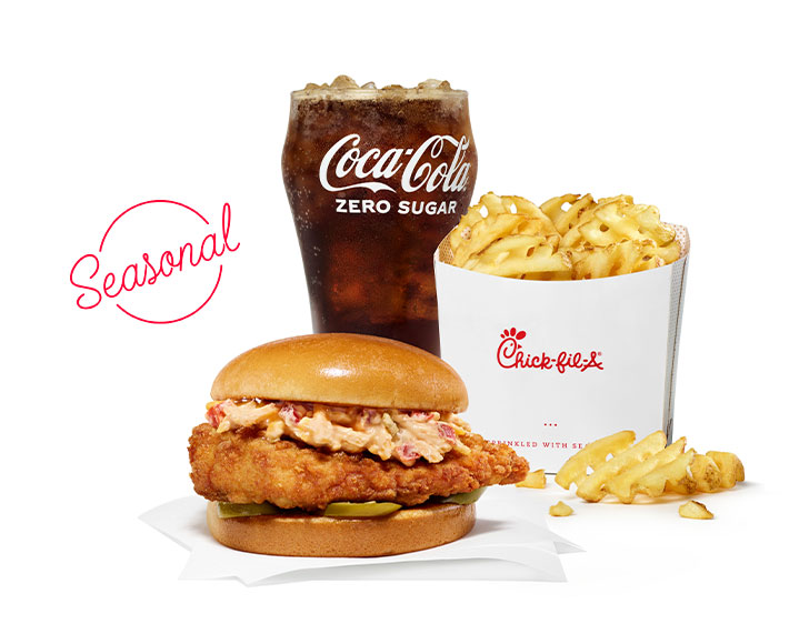 Honey Pepper Pimento Sandwich sitting next to Waffle Fries and a glass of Coca-Cola with a "Seasonal" graphic over them