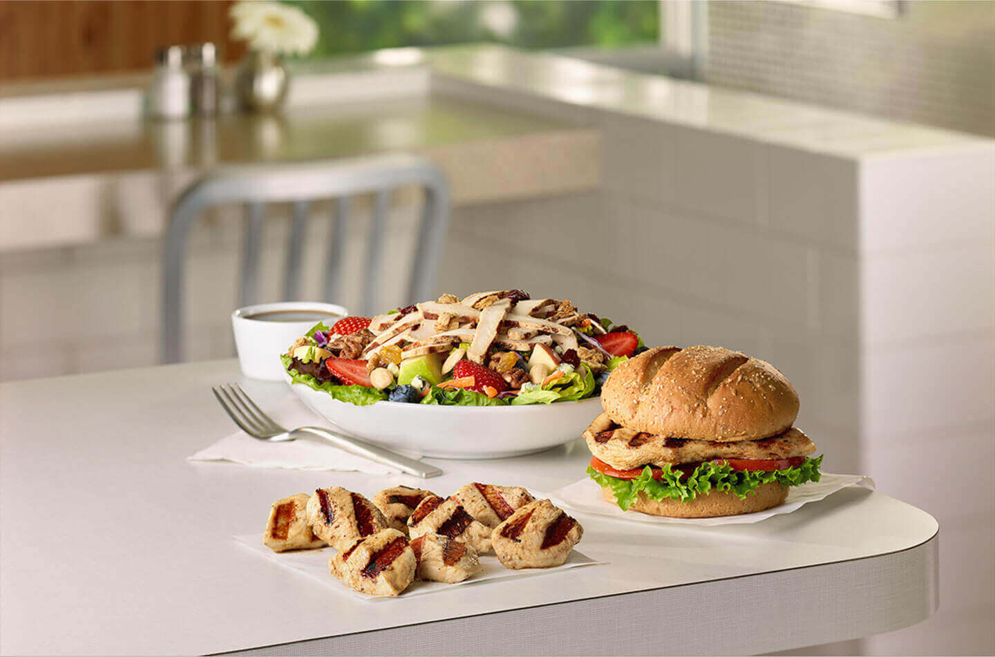 Grilled chicken sandwich, grilled chicken nuggets, and a grilled chicken salad
