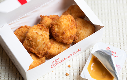 8-count Chick-fil-A® Nuggets in a package with Chick-fil-A® Sauce
