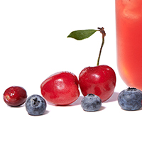 Closeup photo of cherries, blueberries and cranberries