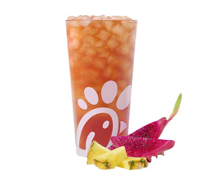 A glass of a Pineapple Dragonfruit Iced Tea on a white background