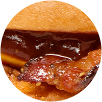 Closeup of BBQ sauce and bacon