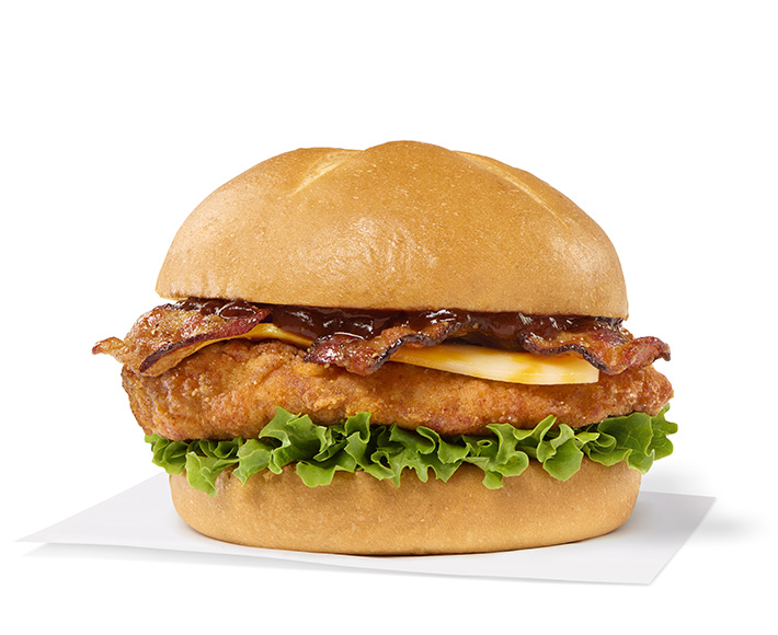 Smokehouse BBQ Bacon Sandwich with Original filet sitting on a napkin on a white background