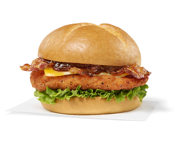 Smokehouse BBQ Bacon Sandwich with Spicy filet sitting on a napkin on a white background