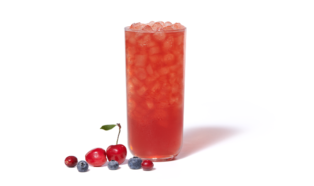 Cherry Berry Iced Tea on a white background with cherries, cranberries and blueberries