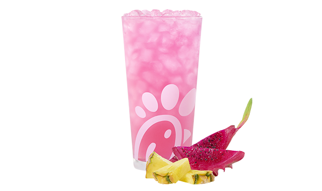 A glass of a Pineapple Dragonfruit Lemonade on a white background