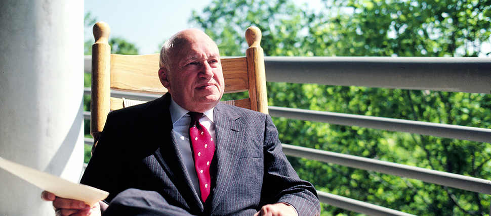 Truett Cathy sitting in a rocking chair