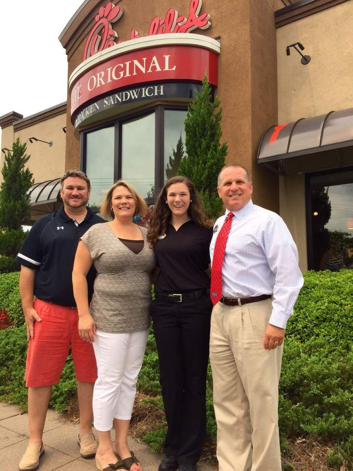 Wilson family photo in front of the same restaurant they worked at 25 years ago