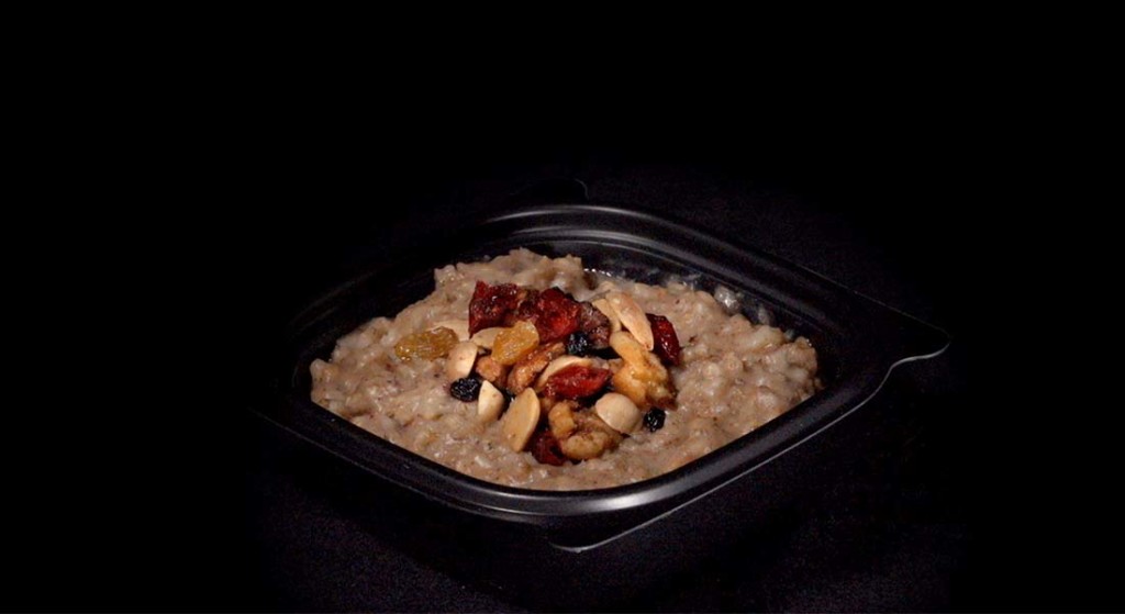 Bowl of oatmeal with dried fruit and nuts