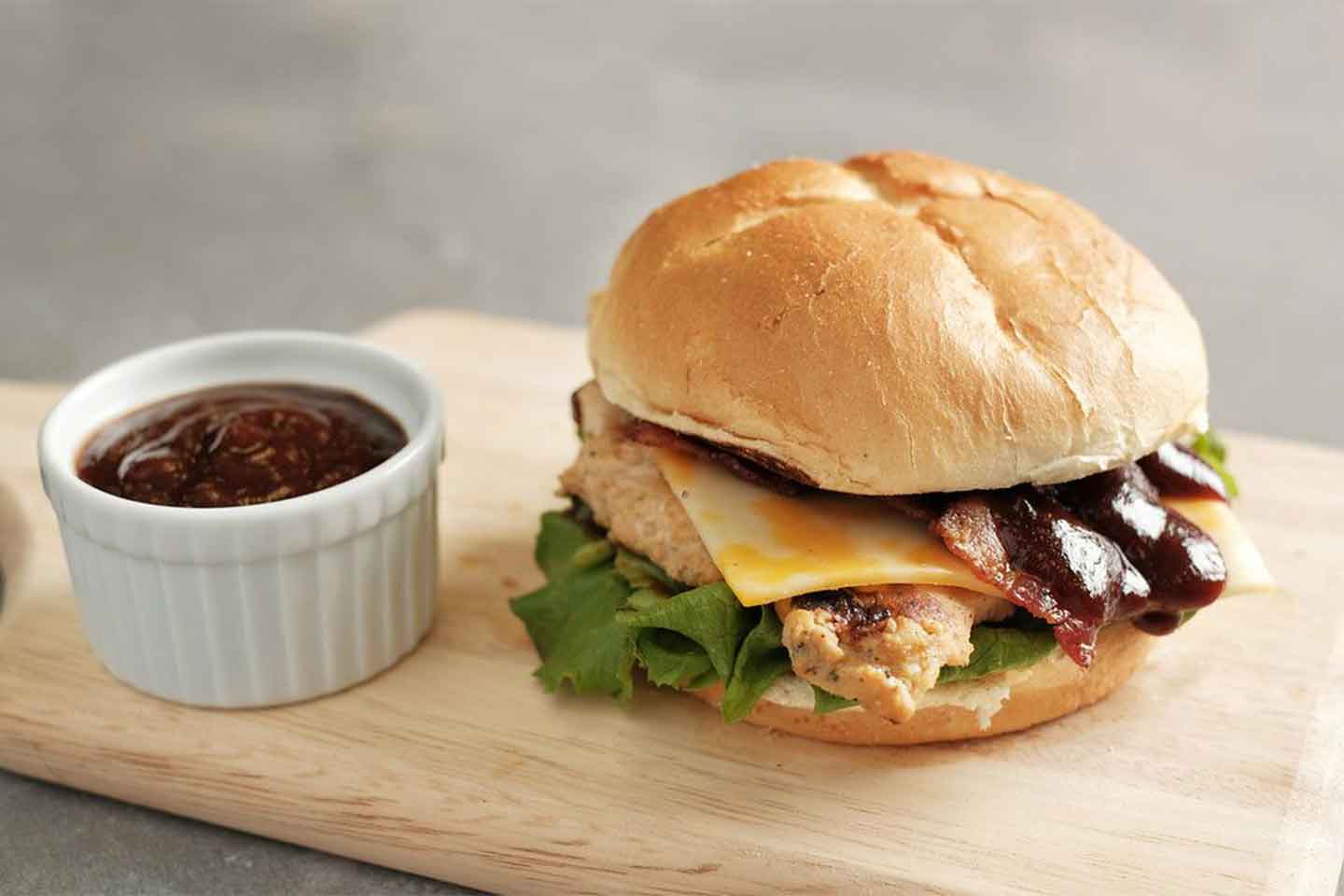 Chick-fil-A Smokehouse BBQ Bacon Sandwich with a side of barbeque sauce