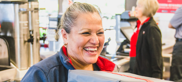 Chick-fil-A Delivery Driver standing in restaurant and grinning